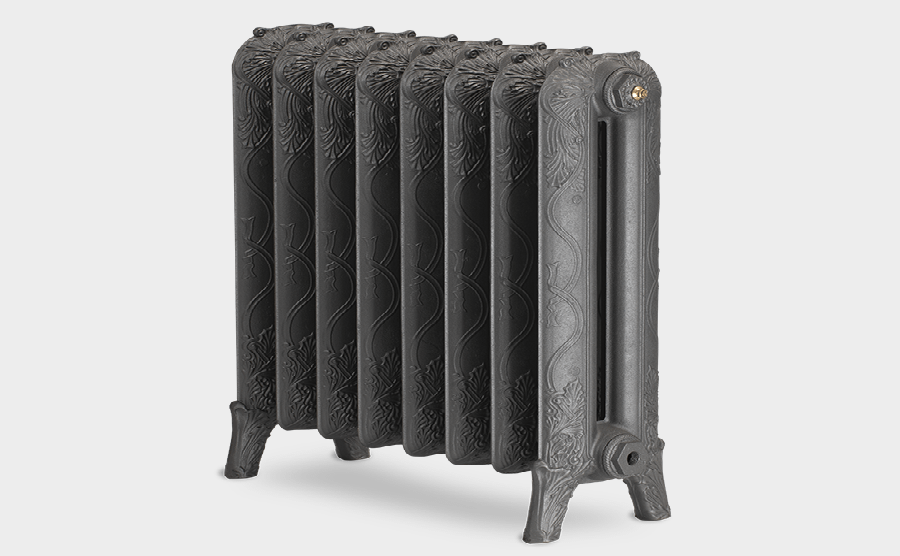 An ornate silver steam radiator